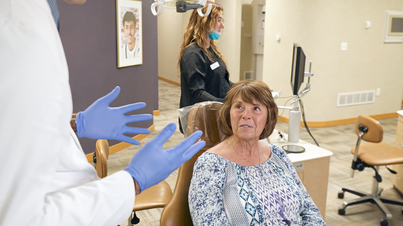 Orthodontist adjusting braces for a patient in Grand Rapids, MI
