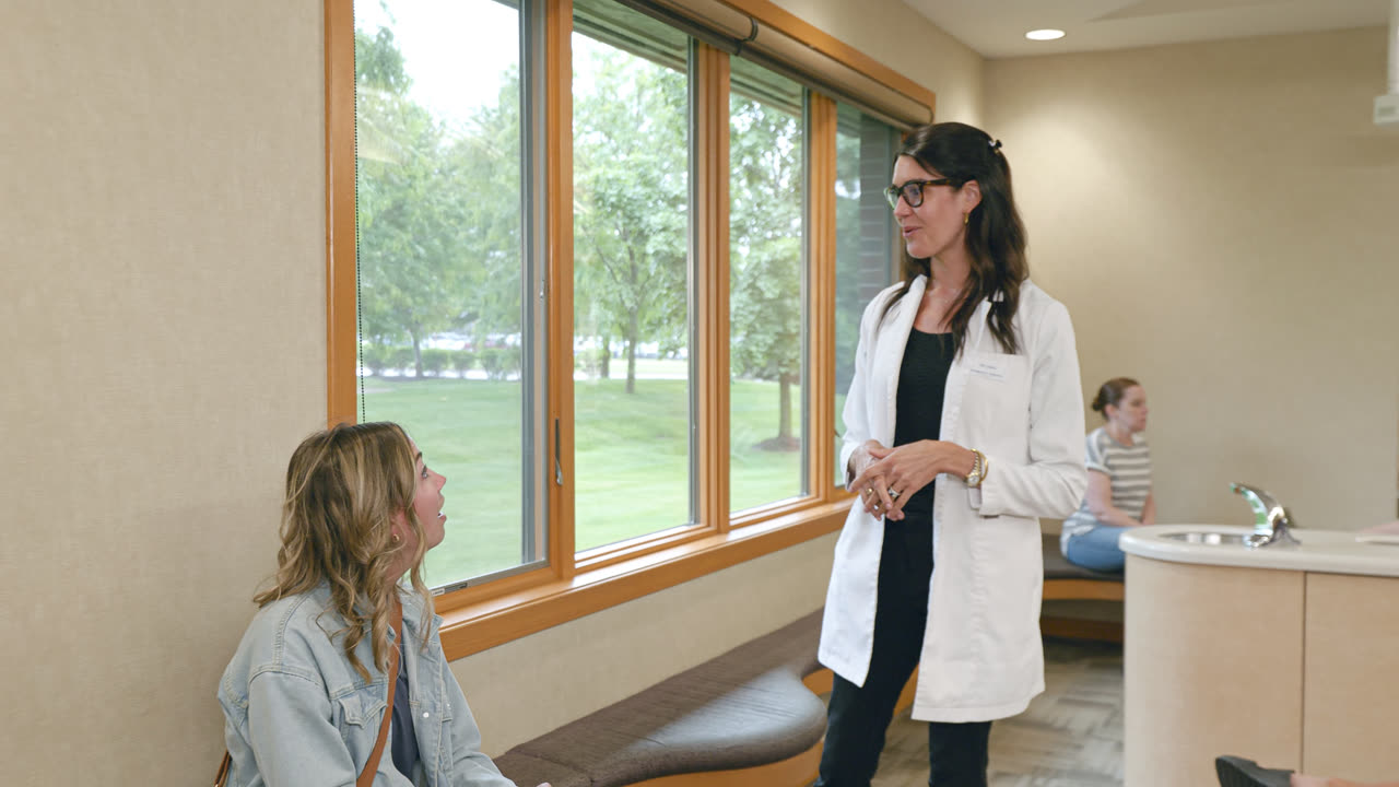 Orthodontist talking with a young patient at our Grand Rapids, MI office