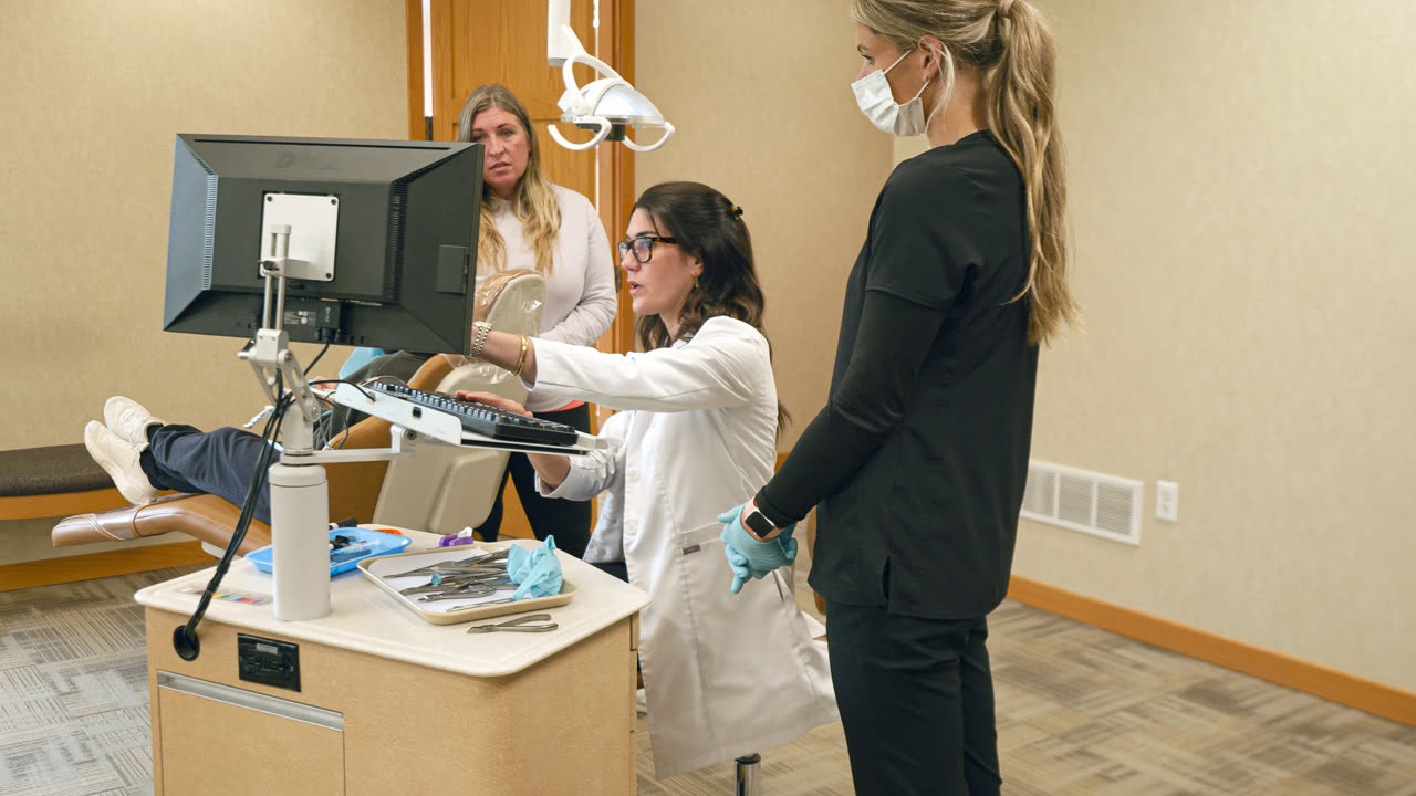 Clinical team preparing a patient for treatment at our Grandville, MI office